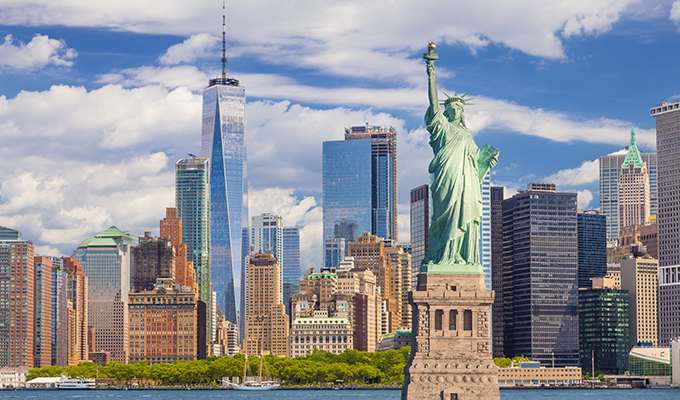 The Statue of Liberty with the One world Trade building center over hudson river and New York cityscape background, Landmarks of lower manhattan New York city. 
