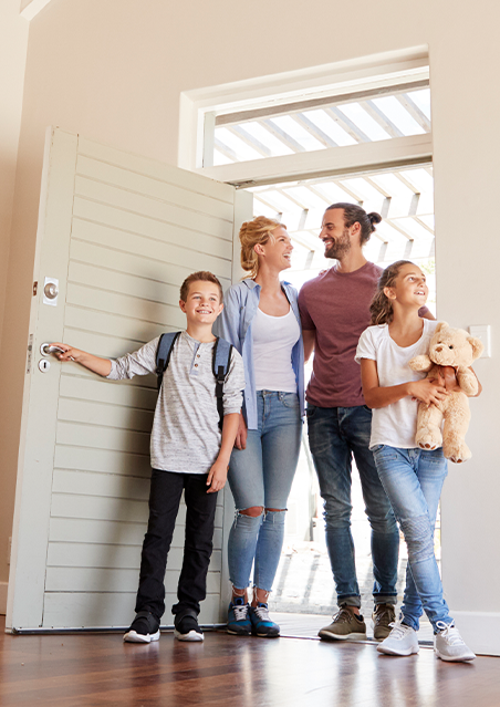 Family walking into house