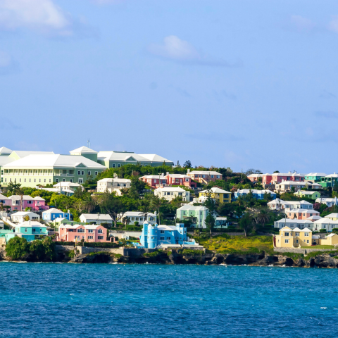 Colorful Homes and resort hotels on a hillside overlooking the Atlantic Ocean in Bermuda