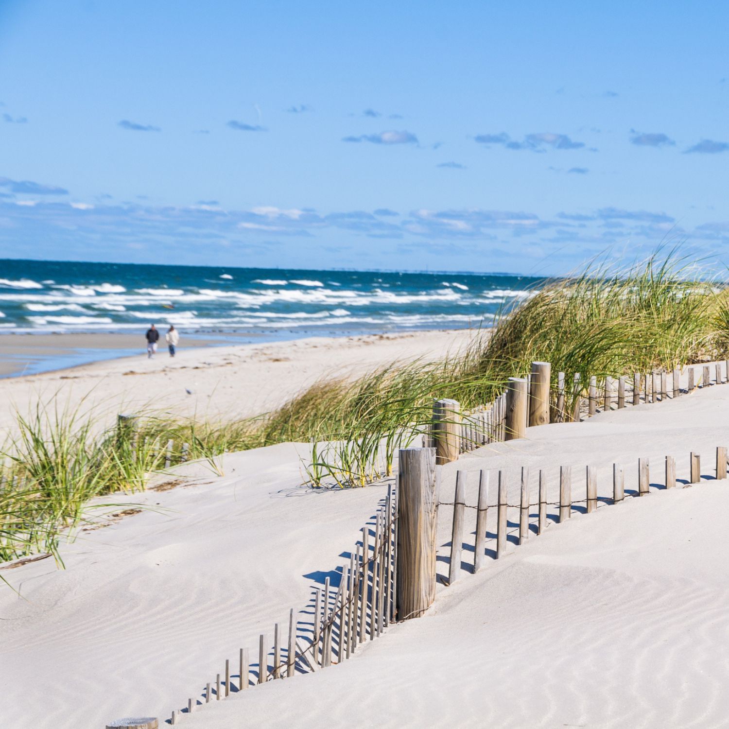 couple walking on beach at Cape Cod