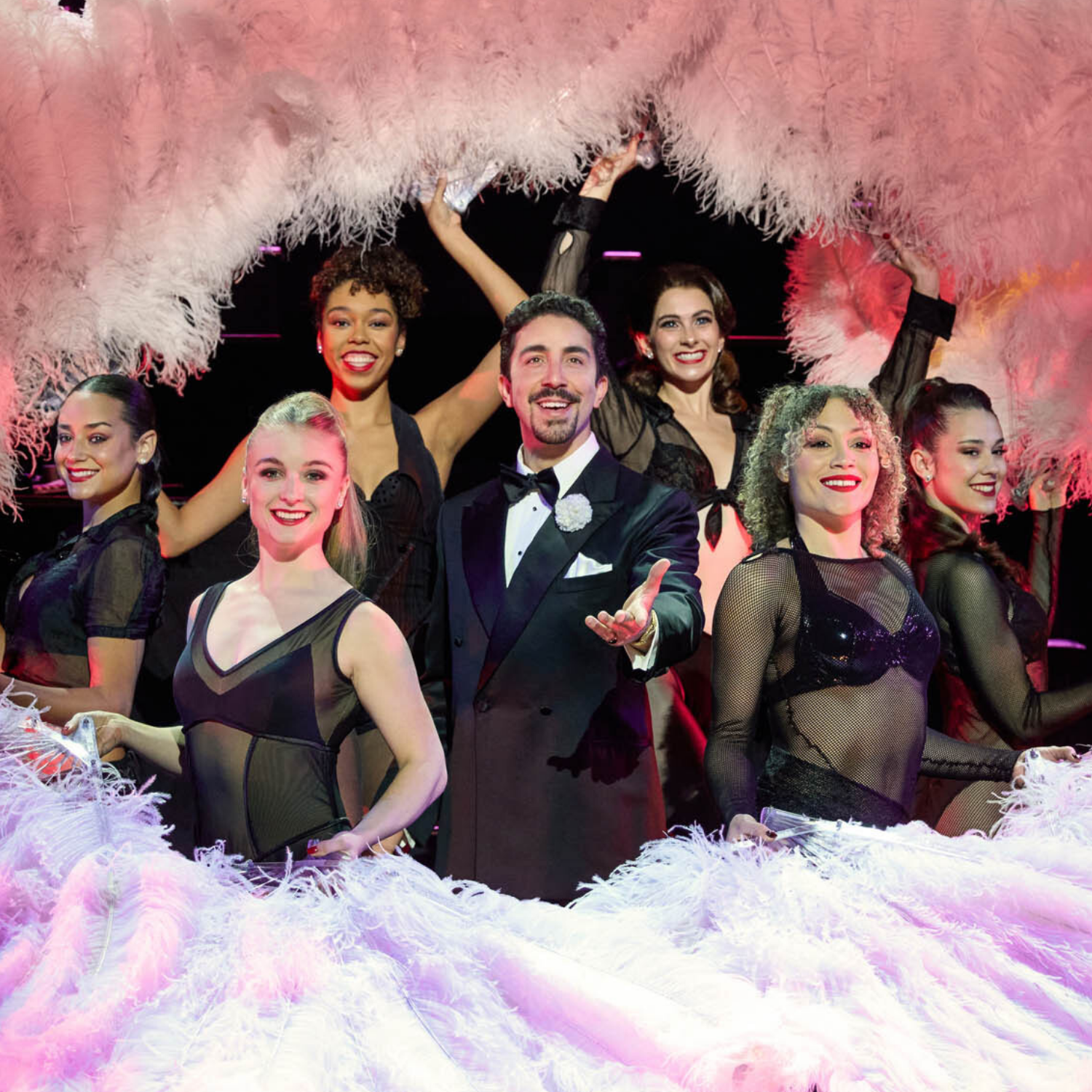 Chicago on stage - man in middle with burlesque dancers around