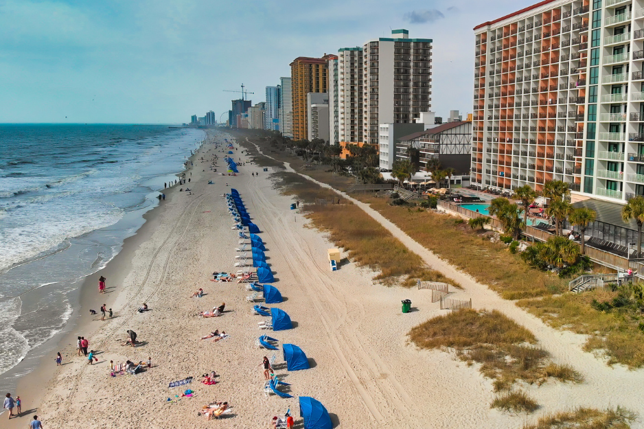 Aerial view of Myrtle Beach, South Carolina. Buildings and beach at sunset.