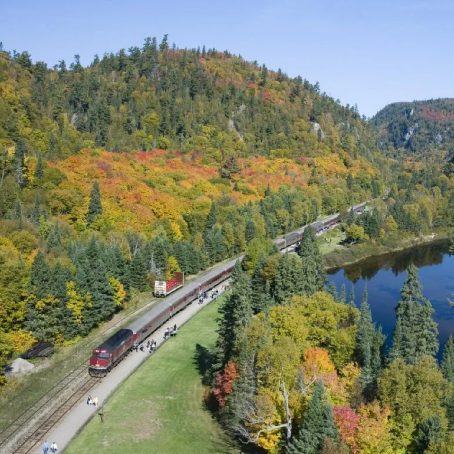Red train stopped in Agawa, Ontario for embarking