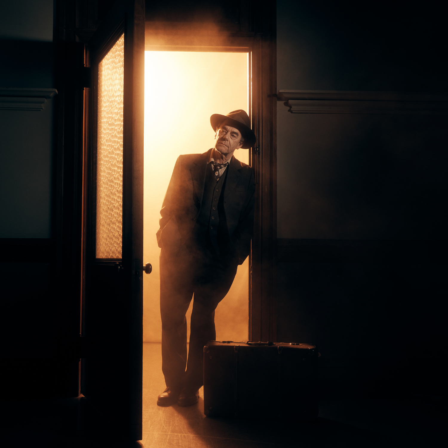 actor playing biff loman, standing in doorway