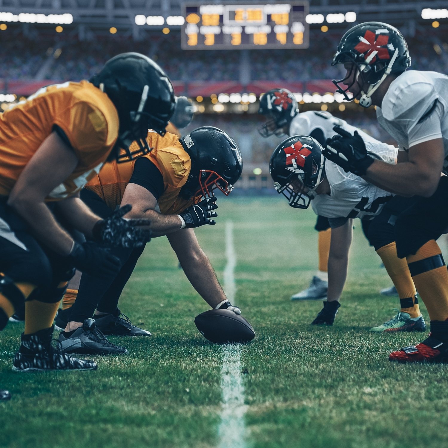 football players ready to play on field at starting line