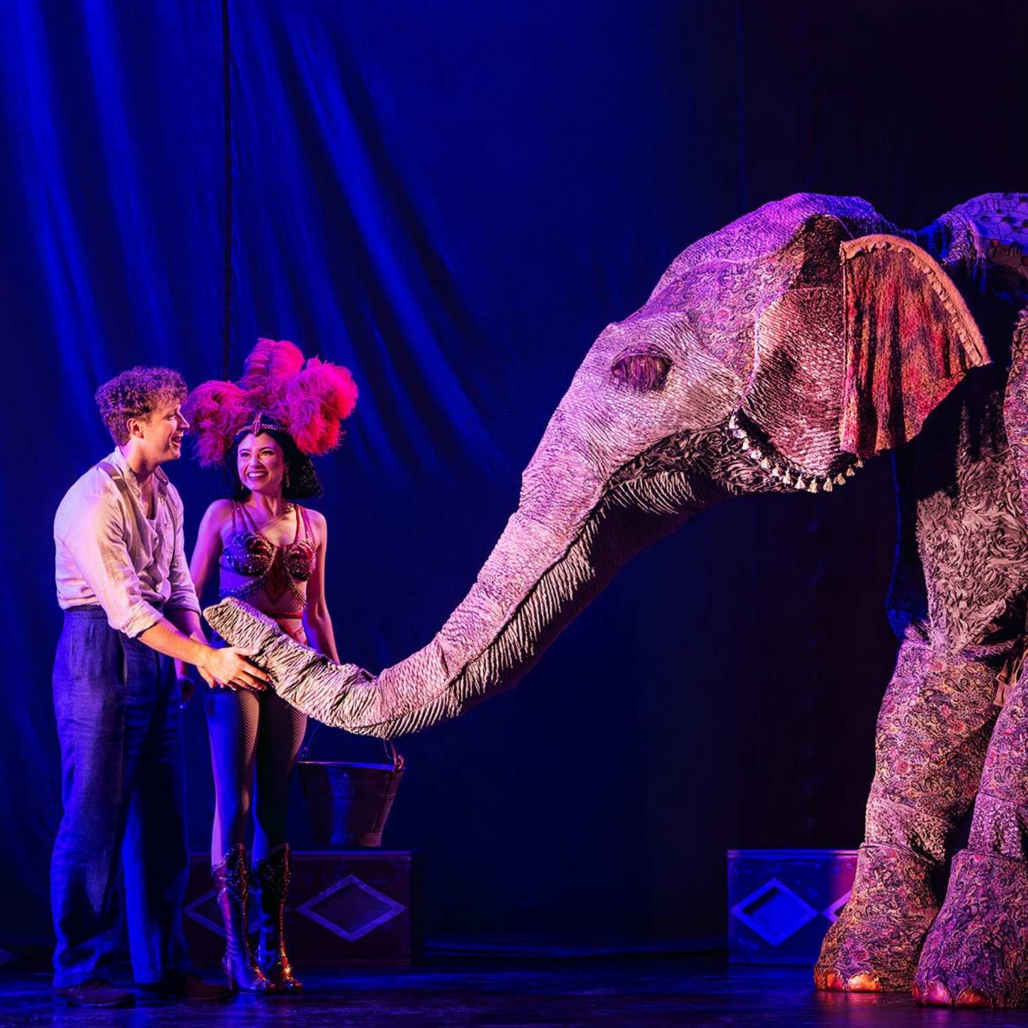 couple on stage with mechanical elephant