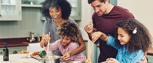 Young family cooking dinner