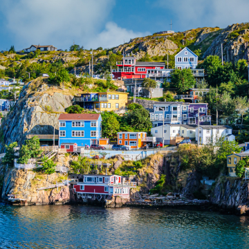 colorful homes on the rocky hillside of The Narrows, an inlet entering St. John's Harbor