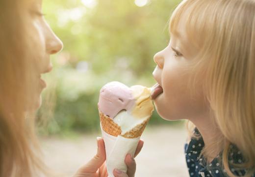 Mother and daughter eating ice cream