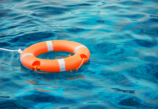 Life preserver floating in water