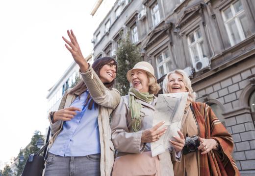 ladies exploring the city, looking at map