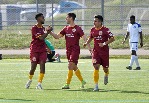 Roma Wolves players celebrating a goal