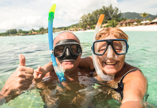Senior couple snorkeling