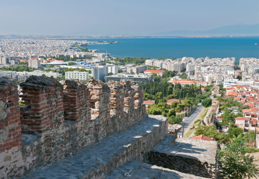 An old city wall in Thessalonika, with the aegean sea and mount olympus in the background