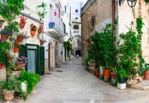 Traditional charming towns of southern Italy in Puglia region - Monopoli old town with floral narrow streets.