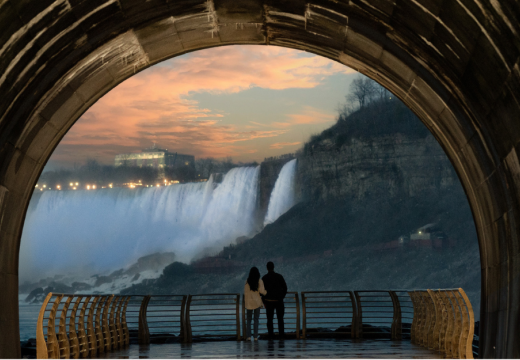 couple looking at the falls at sunset from the niagara parks power station tunnel