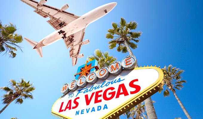 Plane over Las Vegas Sign