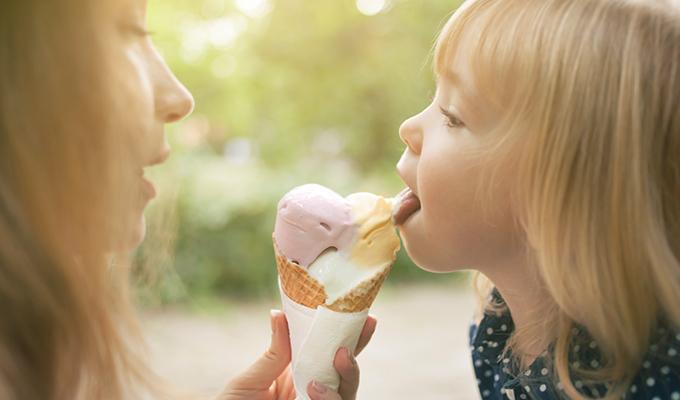 Mother and daughter eating ice cream