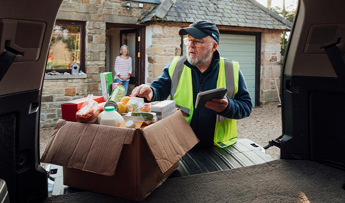 Man delivering food to house