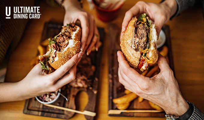 People eating hamburgers at a restaurant