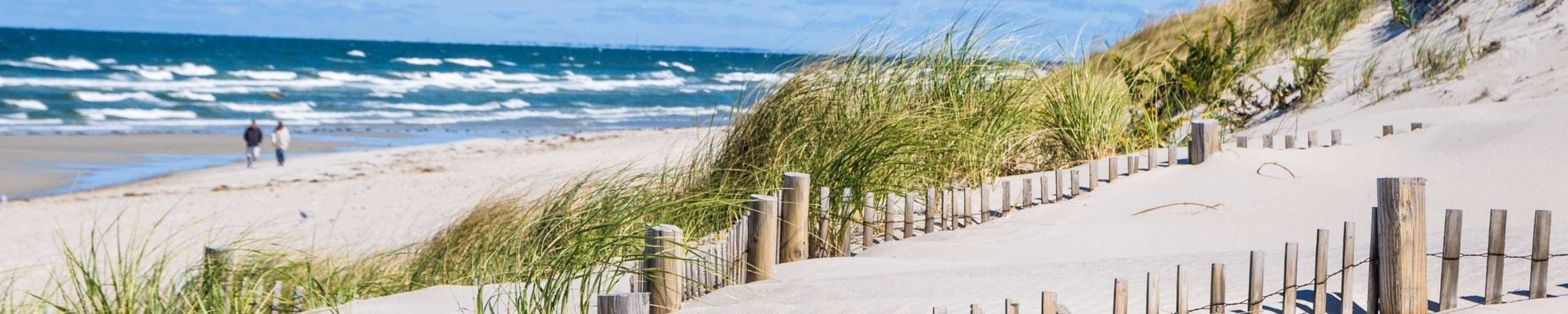 couple walking on beach at Cape Cod