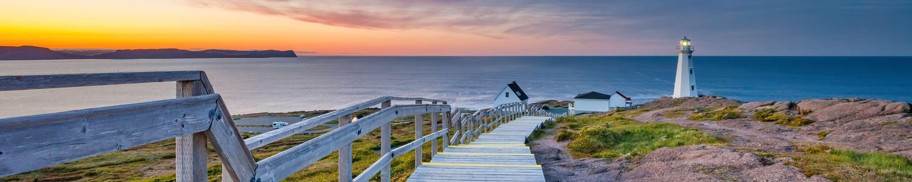 Boardwalk leading to the Cape Spear Lighthouse near St John's, Newfoundland, Canada at sunset. Cape Spear is the most easterly point in Canada.