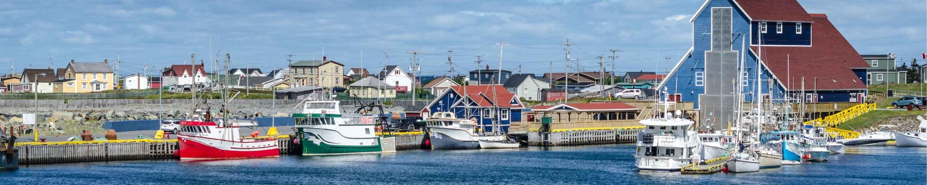 Fishing boats at docks in the villages' harbours in Bonavista, Newfoundland, Canada.