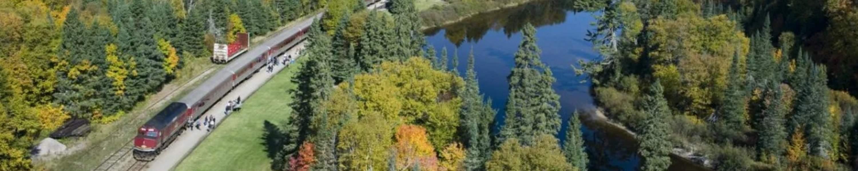 Red train stopped in Agawa, Ontario for embarking
