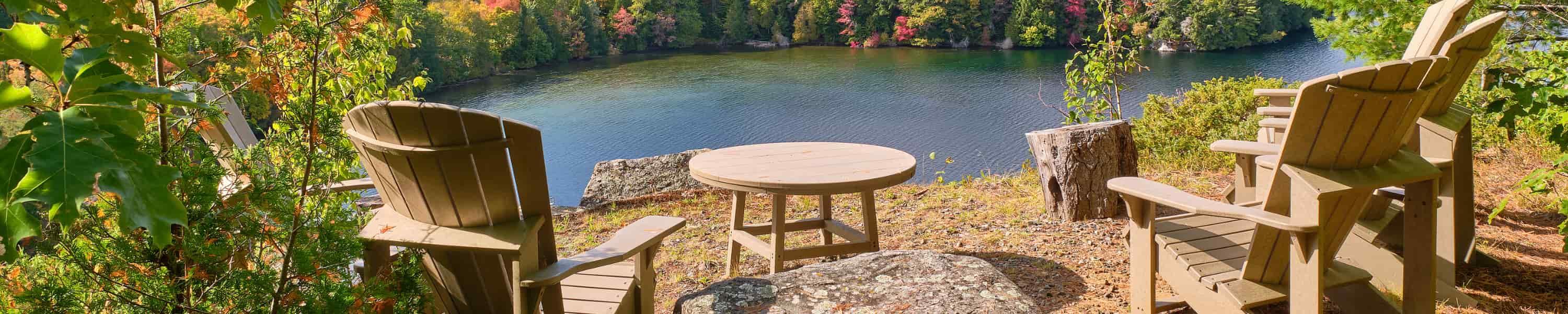 2 chairs over looking a river