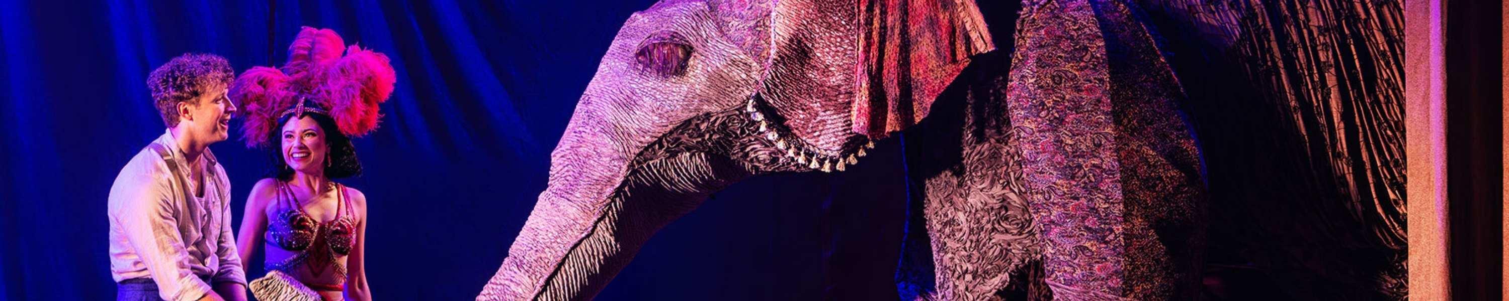 couple on stage with mechanical elephant