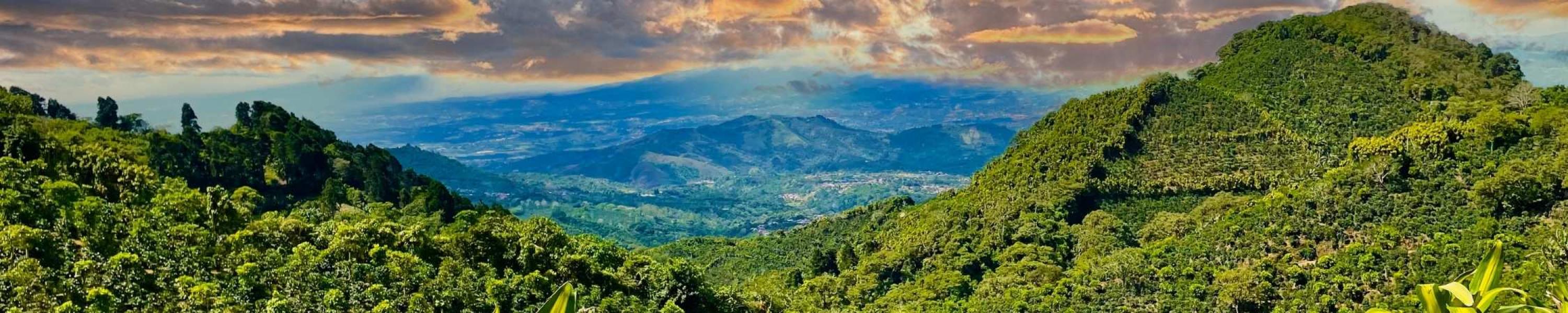 Costa Rica Sunset with mountains and lush greenery