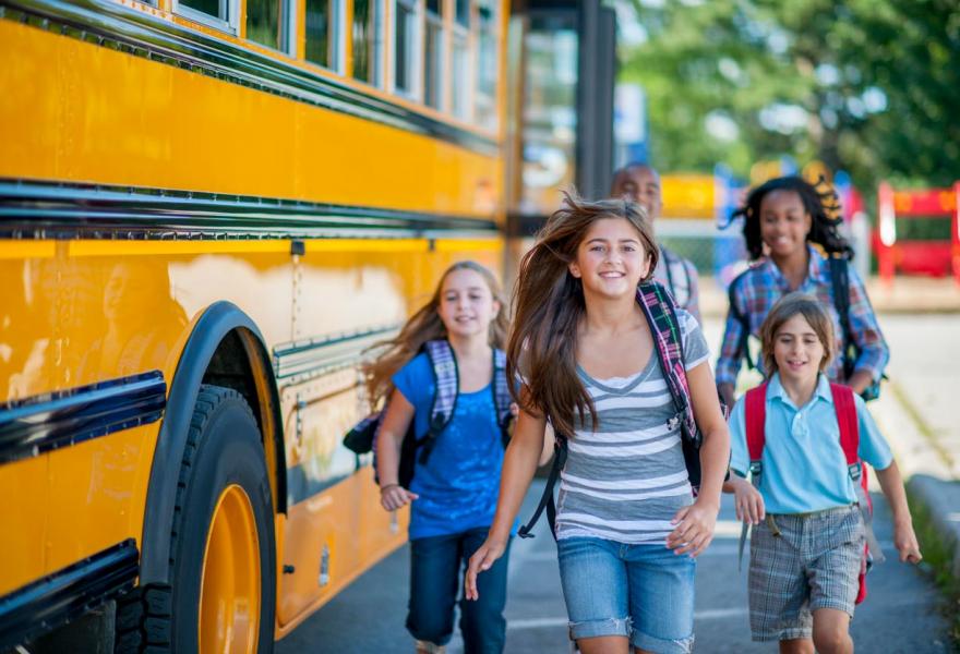 Children getting off a school bus
