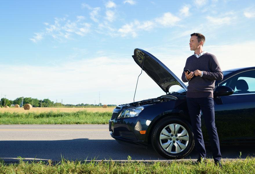 Man calling CAA for Roadside Assistance