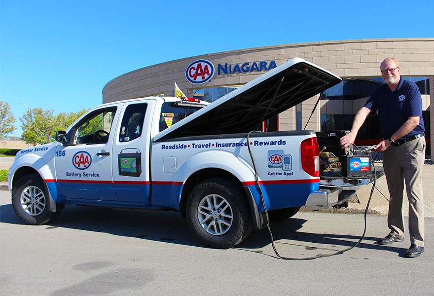 CAA Niagara President & CEO, Peter Van Hezewyk boosting a car battery
