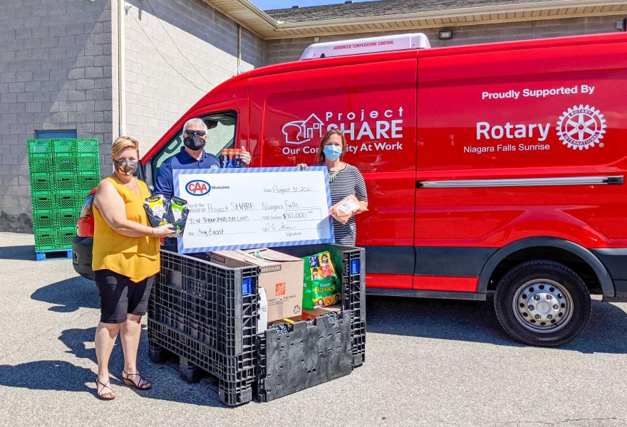 CAA Niagara VP of Automotive Services, Bill Willard, presenting food donations and surprise cheque to Project SHARE_Courtesy of CAA Niagara
