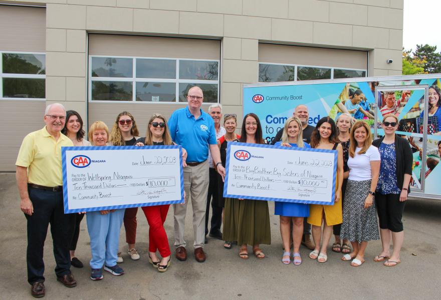 1.	The Wellspring Niagara, Big Brothers Big Sisters of Niagara and CAA Niagara teams posed with the $10,000 “big cheque” donations from the club.
