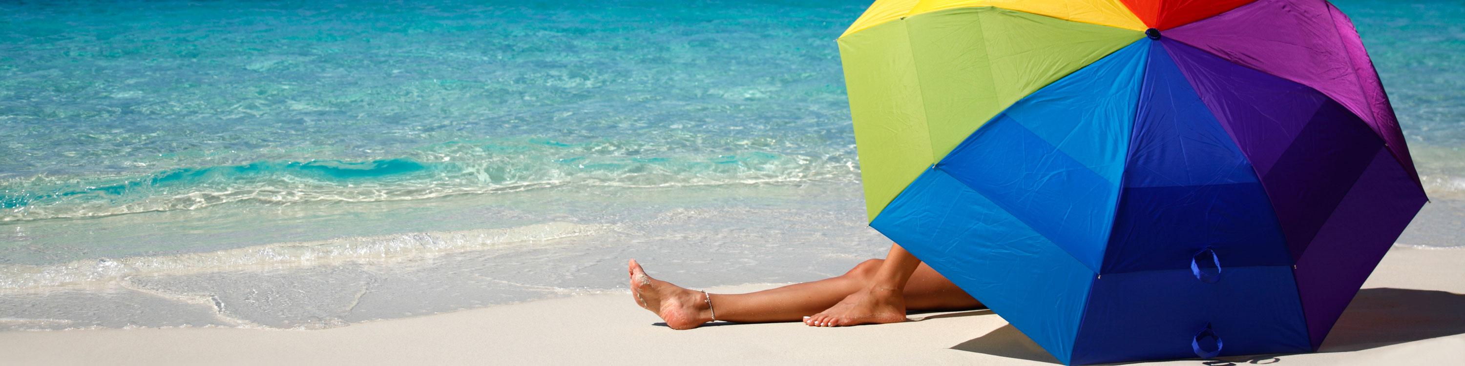 Umbrella on Beach, CAA Travel Insurance