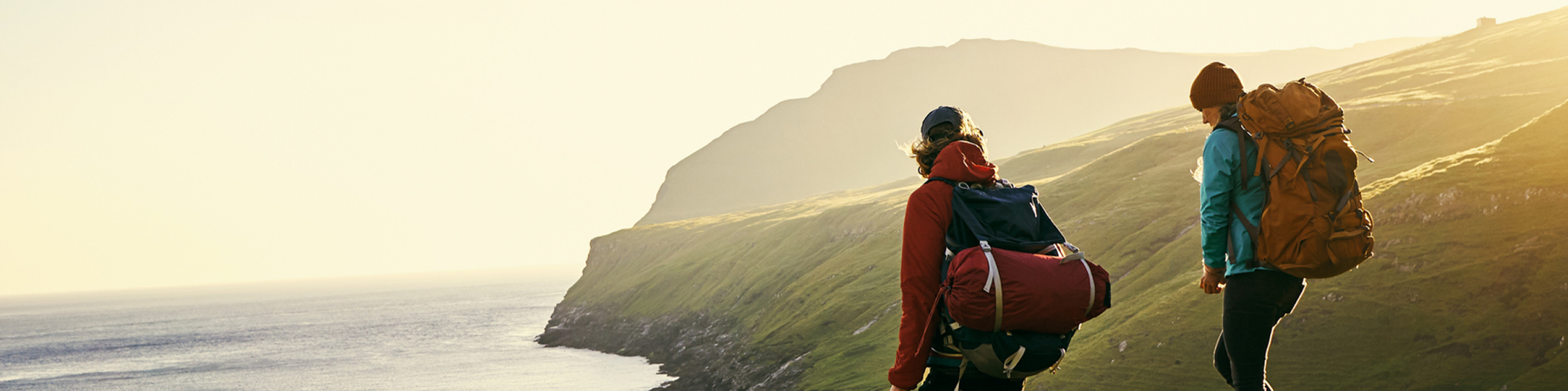 Shot of a young couple hiking through the mountains.