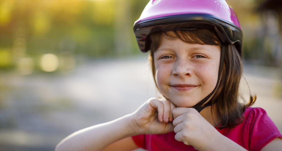 Child Cyclist Wearing a Helmet